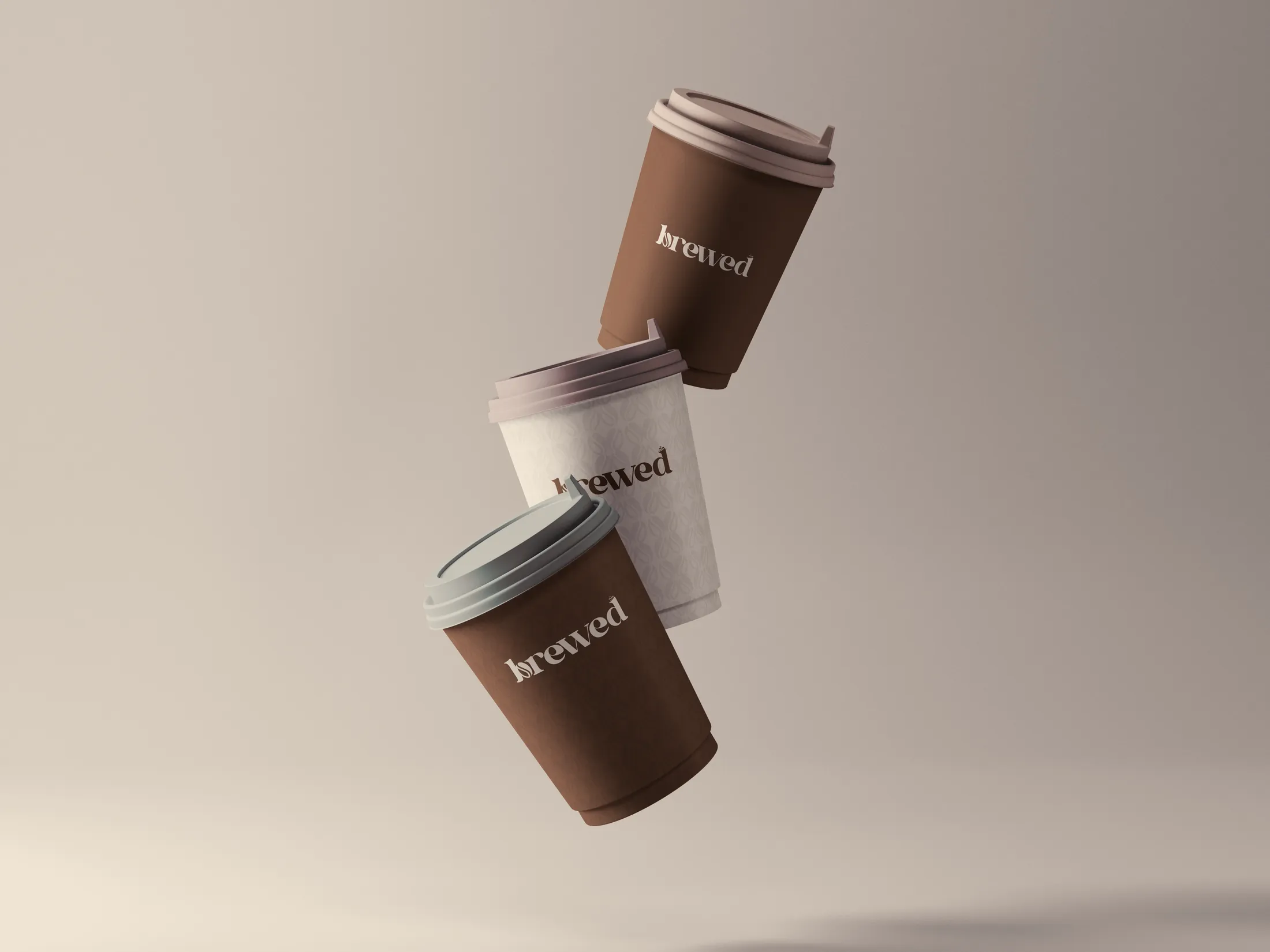 Three floating 'brewed' takeaway coffee cups on a soft neutral backdrop.