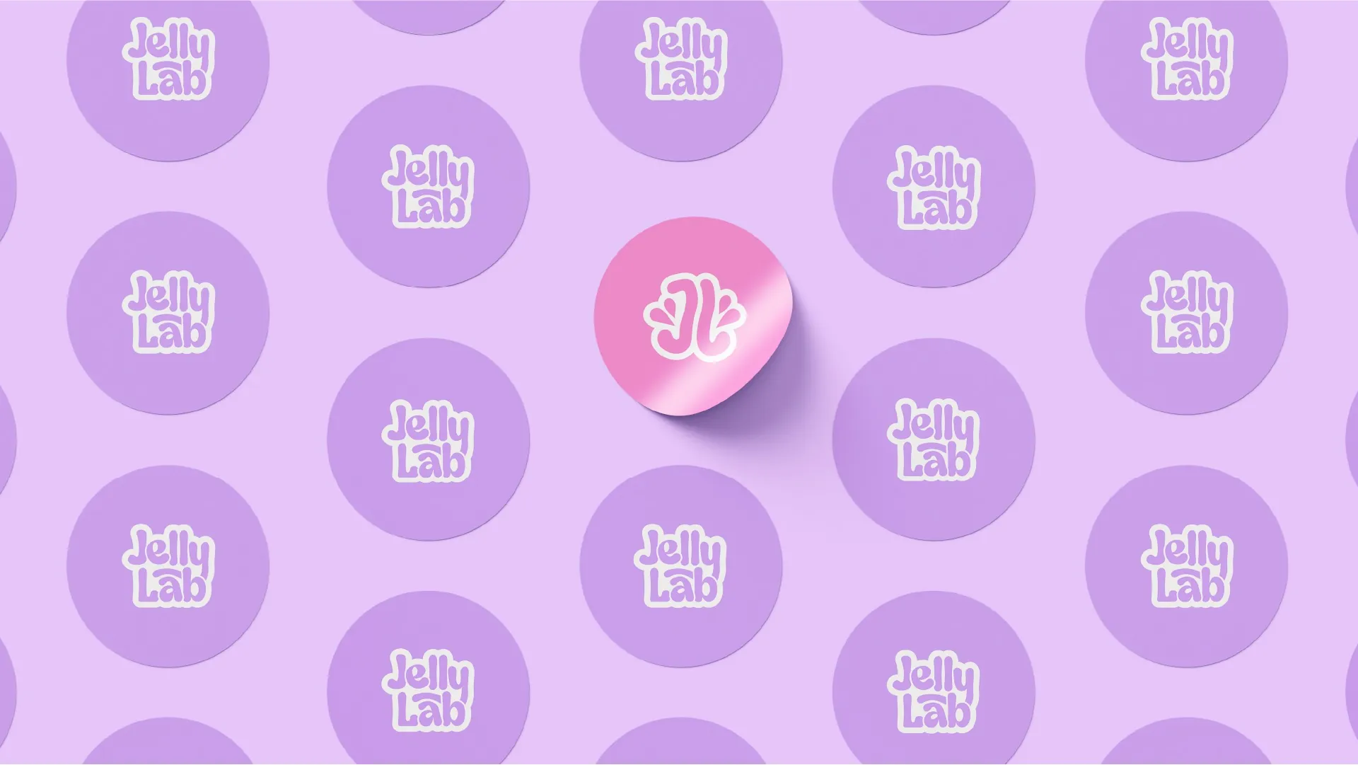 A lilac pattern of JellyLab logo stickers with one glossy pink logomark sticker at the centre.